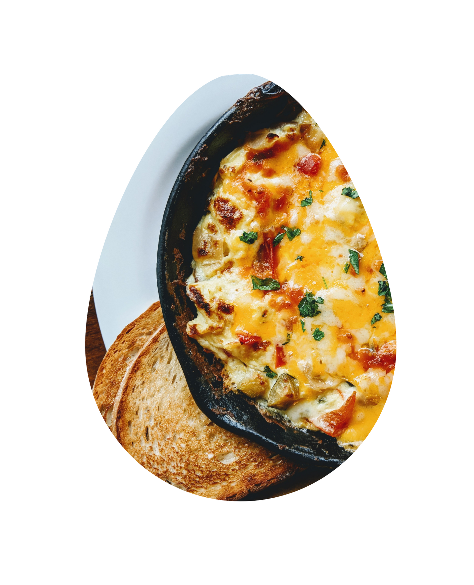 An Egg Frittata in a pan with a slice of toasted bread